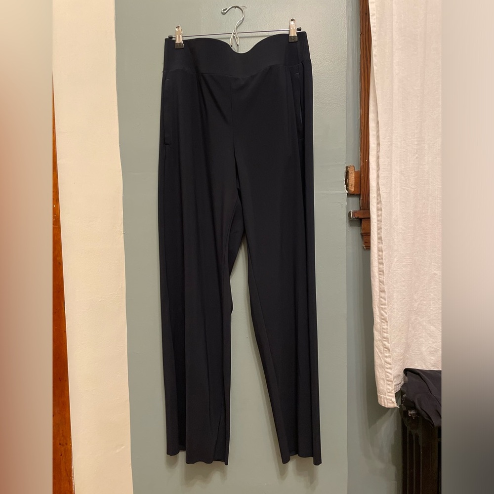 Athleta Cosmic Pants in black. High wasted and wide leg with zippered pockets.